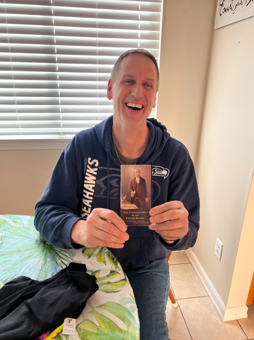 Lake Stevens resident Bill Studerus holding a signed copy of the Constitution. (Belle Hedglin)