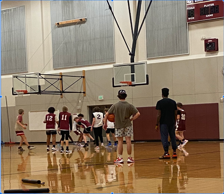 On December 6th 2022  Coach Jerard Rabb and Coach Ryder Kavanagh watch the Freshman run a play they will use in a game in their practice that night.  (pc:Cora Quintel)