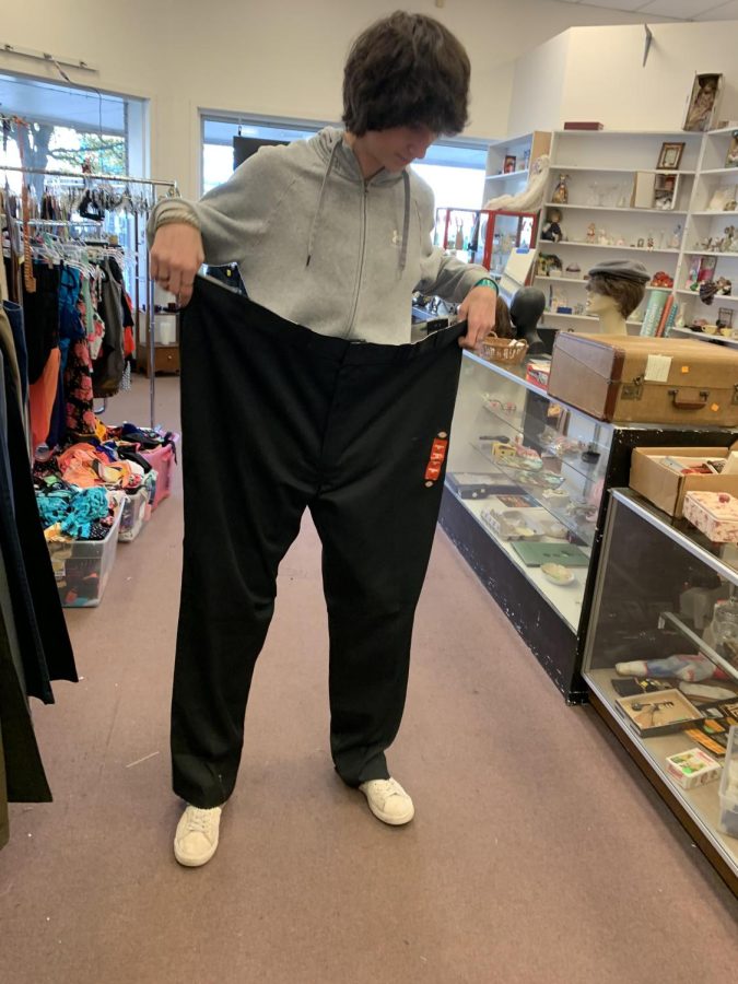 James Michaud laughing in Fabulously Frugal during a thrift shopping trip after spotting these comically large Dickies 874 pants. This was taken on November 27th (Judah Michaud)
