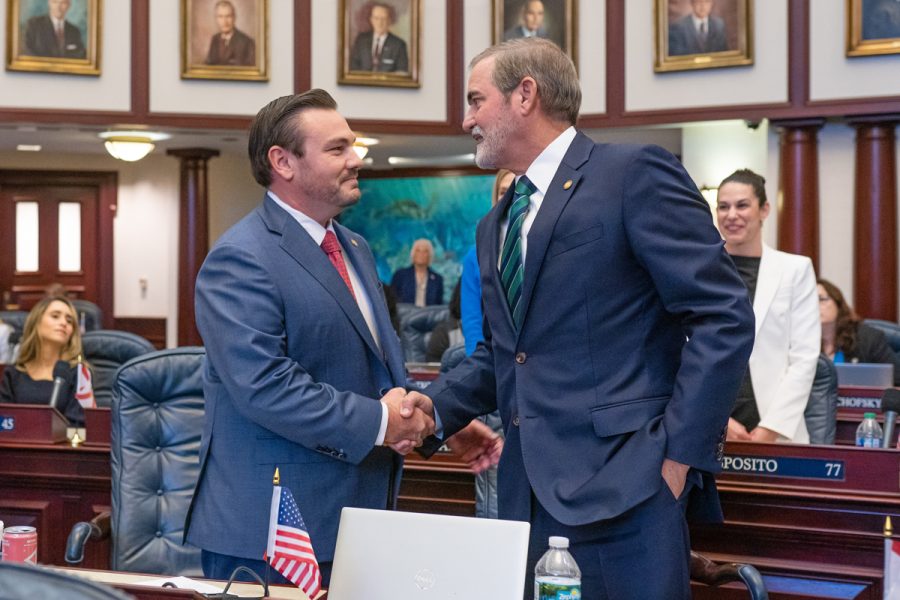 Open Image  Rep. Adam Anderson, R-Palm Harbor, and bill co-sponsor, Rep. Stan McClain, R-Ocala, celebrate the passing of CS/CS/HB 1069, their bill relating to Education, on the House floor. March 31, 2023 (Credits to Representative Stan McClain photo gallery) 