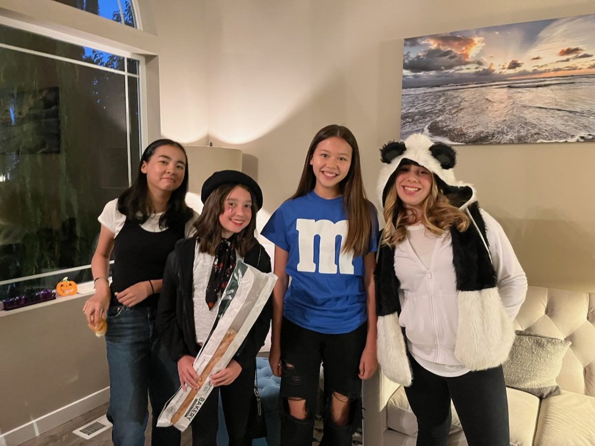 Cavelero students (left to right) Juliana Manley, Amanda Pfiester, Liah Campbell, Andi Heininger, line up in costumes for school dance (2022) Photo courtesy of Shannon Heininger