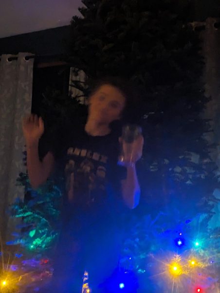 Dylan Arends dancing in front of the Christmas Tree. Taken on December 3rd 2023 by Eliy Arends.