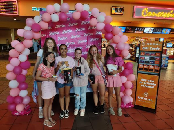 A group of friends take a picture by the entrance of the highly anticipated “Barbie” movie. From left to right, Moxie Gerrard, Amanda Pfiester, Juliana Manley, Audrey Marshall, Andi Heininger, Samantha Heininger. (Christine Pfiester)